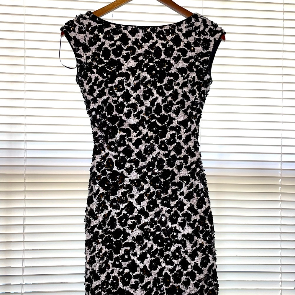 Black and white embellished mini dress.